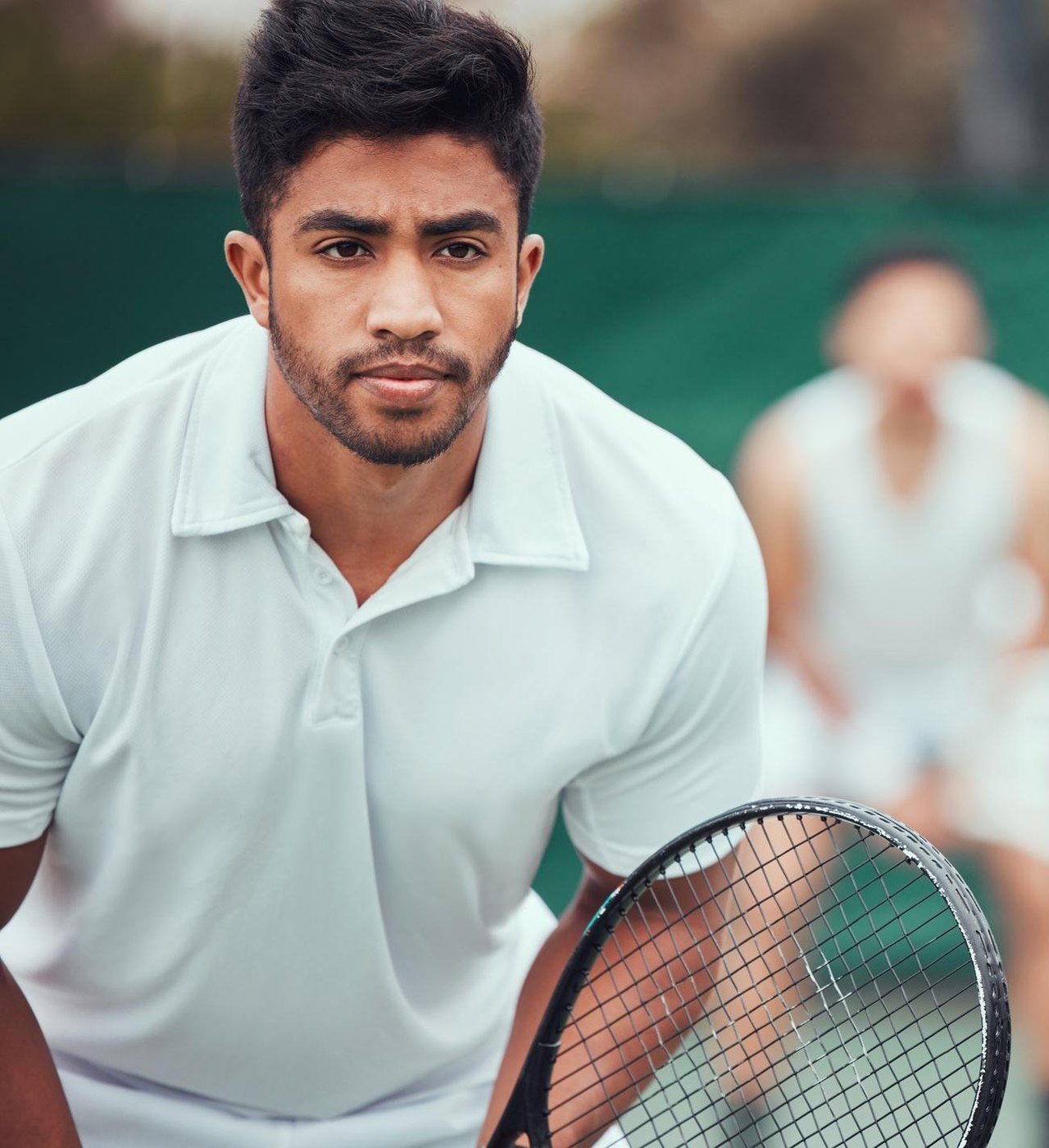 A focused Indian tennis player on court, representing the active KYG community